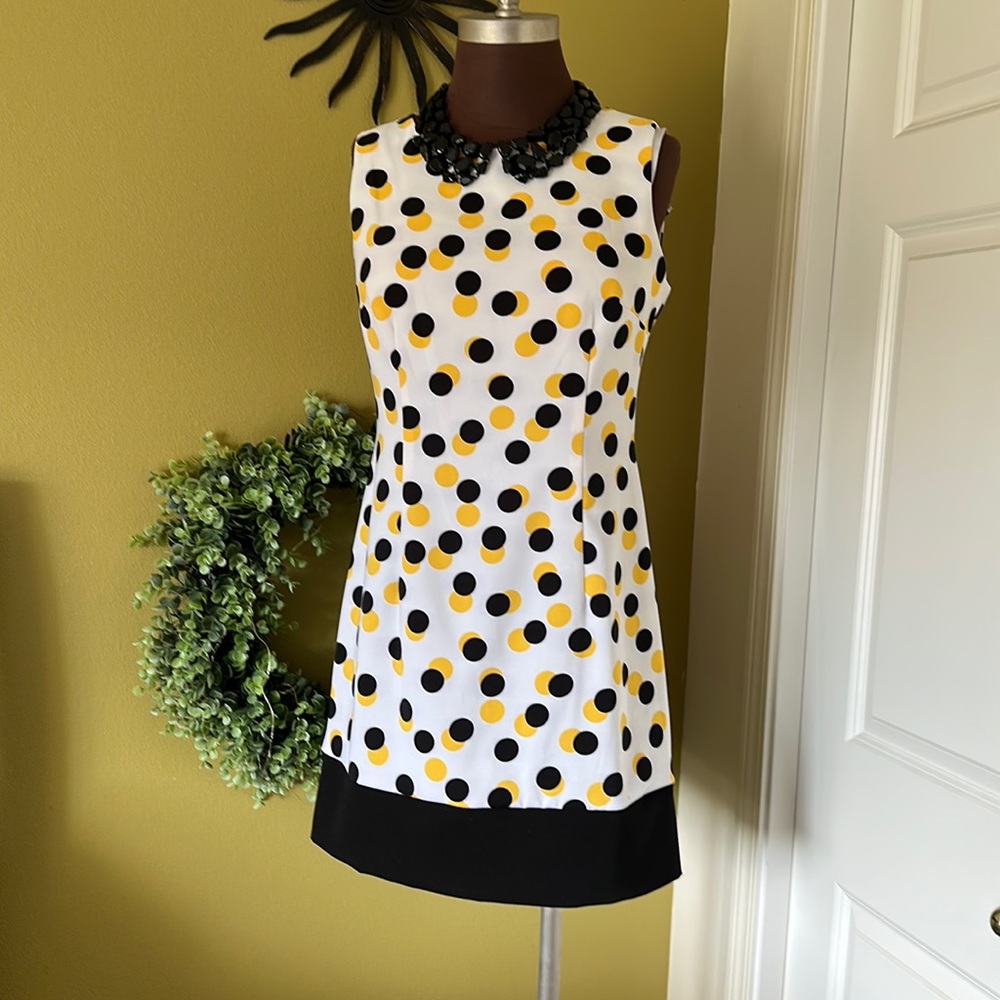 Ronni Nicole yellow and black polka dotted mid length dress. Size 10.